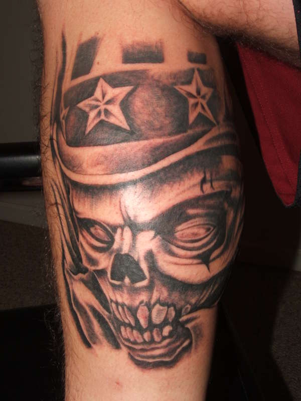 Skull Tattoo Combination With Star Tattoo Designs On The Calf