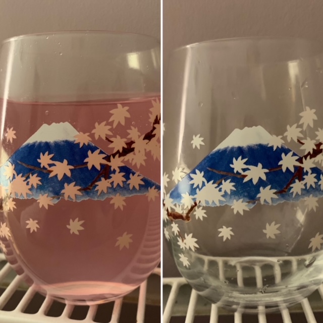 Before and after of a colour changing glass, filled with squash