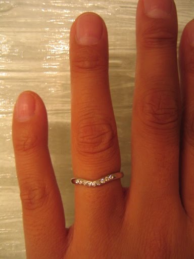 The same ring with diamonds on someone's finger LOVE the daintiness