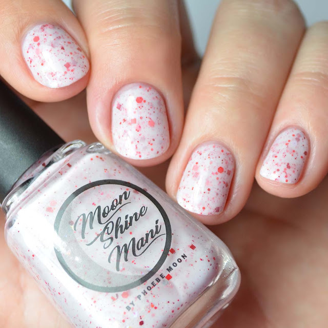 white crelly nail polish with red glitter