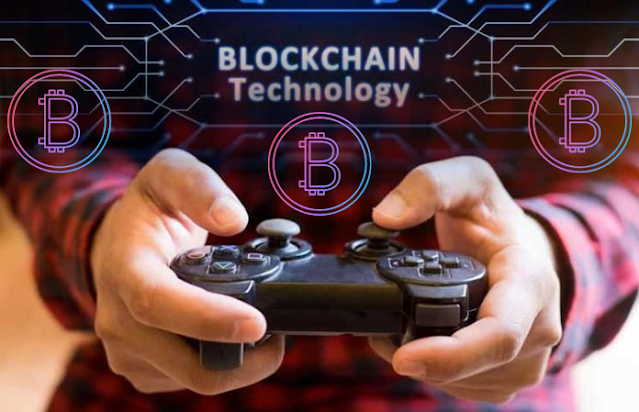 There are two hands holding Playstation controllers in the picture and three signs of Bitcoin are above them