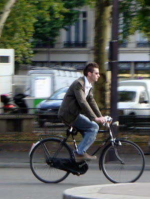 Dapper Parisian on a bike