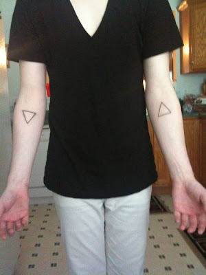 have triangle tattoos