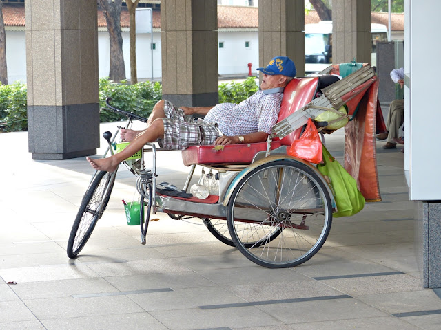 Rickshaw taking a nap on the streets of Singapore 