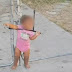 Screaming toddler found tied to wire fence with bungee cord around her neck