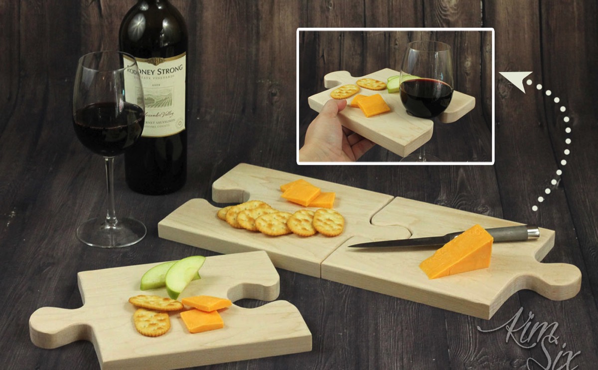A set of puzzle piece shaped cutting boards that combine together to form one large cutting board, or seperated can be used individually as serving trays with built in wine glass holders.jpg