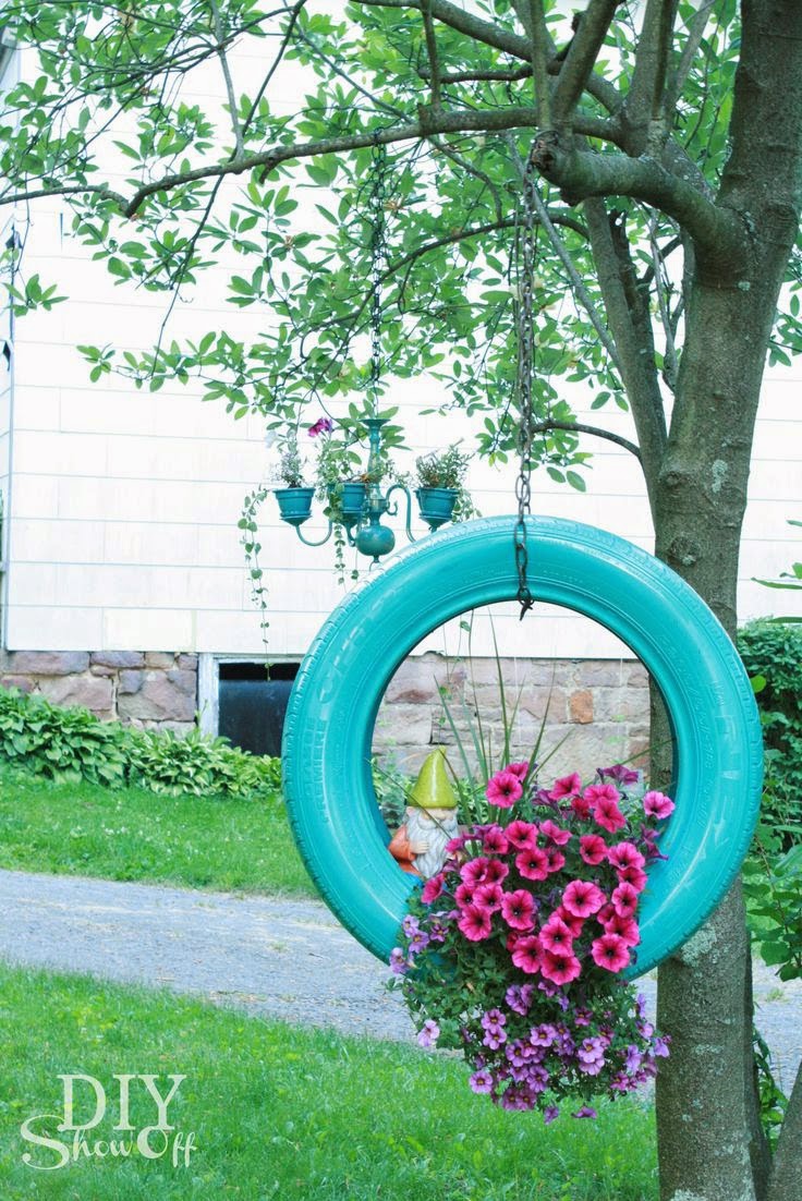 http://diyshowoff.com/2013/07/02/diy-tire-planter-tutorial/