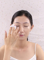 Press and sweep the Banila Co. Prime Primer Finish Powder on eyelid.  Then pad gently all over the face.