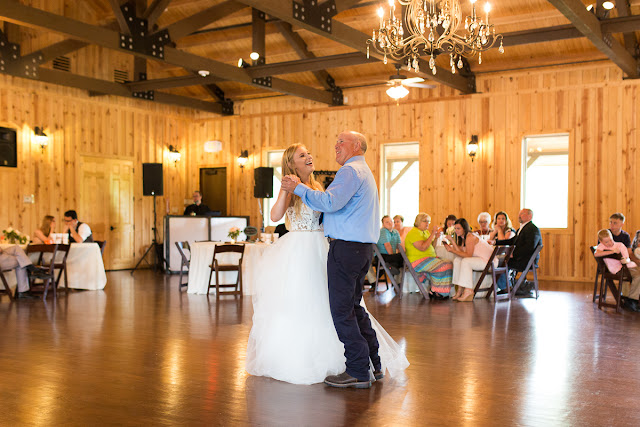 Something old, something new, something borrowed, something blue.  Sarah looked like she could have stepped right out of a Vogue Bridal magazine as she floated down the stairs in her beautiful wedding gown: a fitted, sleeveless, delicate lace bodice above a floor-length skirt, comprised of yards and yards of whimsical, white organza.  Tanner looked dapper in his royal blue suit, paisley tie, white rose boutonniere, and fancy, wood-grained leather shoes.  The bridesmaids and maid-of-honor wore individually designed, pale-pink, floor-length gowns and carried small bouquets similar to the bride’s pastel bouquet of beautiful, blush and ivory roses and ranunculus.      The SpringsEvent Venue in Edmond, OK, with its rustic and elegant accommodations, was the perfect setting For Sarah and Tanner’s intimate wedding and reception.  The morning began with First Looks for both the bride’s father, and then Tanner.  The clouds threatened rain throughout the morning—and almost drenched the bride and her maids during the picture-taking for the wedding party—but miraculously cleared up for the outdoor wedding nuptials.  The wedding couple were blessed to have so many people who traveled from throughout the country to celebrate their special day.   Sarah and Tanner agreed that their two favorite parts of the day were “getting to see each other during the first look, and then the actual wedding when we said our vows.”  Sarah said that during the first look, “we were able to spend those precious moments focusing on each other without all the hustle and bustle around us.”  After months of preparation and planning, she said, “the vows were also our favorite because we were finally getting married!”  Sarah’s suggestions to future brides, now that she has experienced her own wedding:  "Each and every moment is special:  getting ready, the first looks, walking down the aisle, the vows, the cake cutting, the dancing…take a moment or two to just slow down and take it all in…you’ll be glad you did!"  It was my pleasure to capture these beautiful memories for Sarah, Tanner and their families that will last forever.  For more information about my Wedding Packages, please visit my Weddings page on my website, www.michellevalantinephotography.com. 