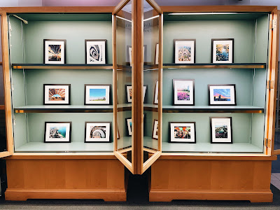 12 framed Chicago fine art photographs by Jenny Lam in the exhibition cases of Popular Library, Harold Washington Library Center, the Chicago Public Library's main branch, on display throughout May for Asian American and Pacific Islander Heritage Month and CPL's 150th anniversary