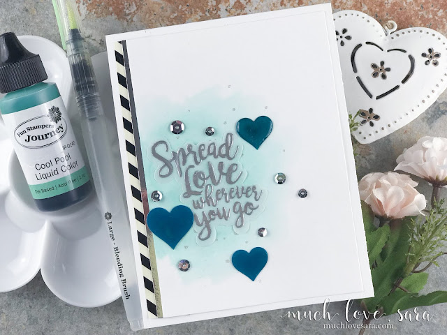 With a pretty watercolor wash, sparkly splattering, and beautiful heat embossed sentiment, this card is a lovely way to wish a bon voyage, good luck to a first time college student, or just because you want to send some love.  Created using Fun Stampers Journey Spread Love Stamp and Die Bundle, and other FSJ products.  