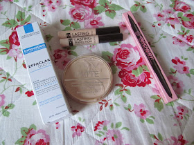 white box, rimmel face powder, brow pencil and two concealer tubes