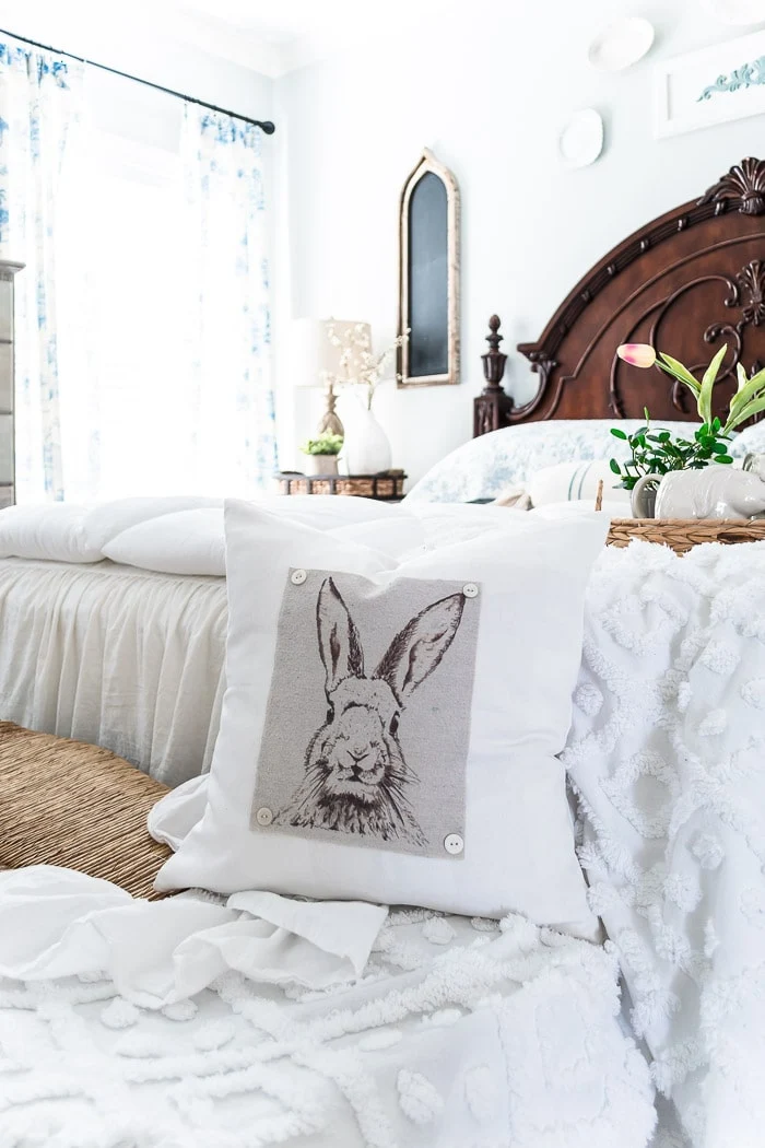 bunny pillow, tulips, white bedding, blue toile curtains