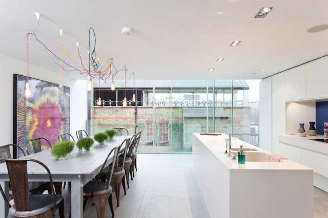 Picture of modern white dining room and kitchen in redesigned water tower