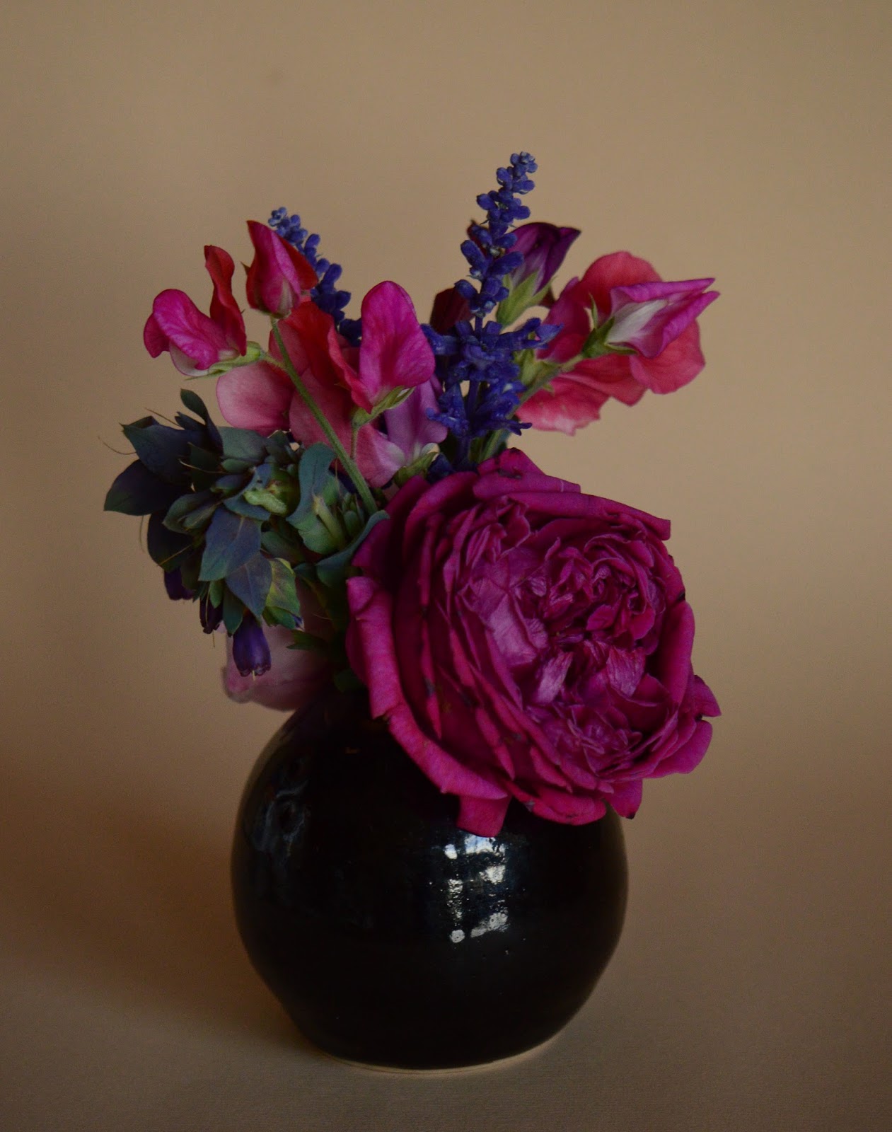 A Small Sunny Garden In A Vase Roses And Sweet Peas