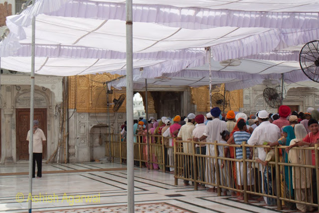 Closer view of the devotees in the queue just outside the Darshani Deori in the Golden Temple complex in Amritsar