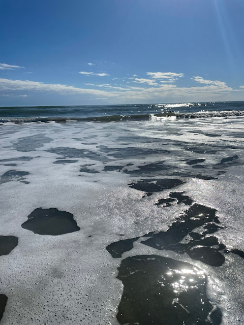 Taken from in the water - this picture shows the waves and water all around. I am standing in ankle deep water.