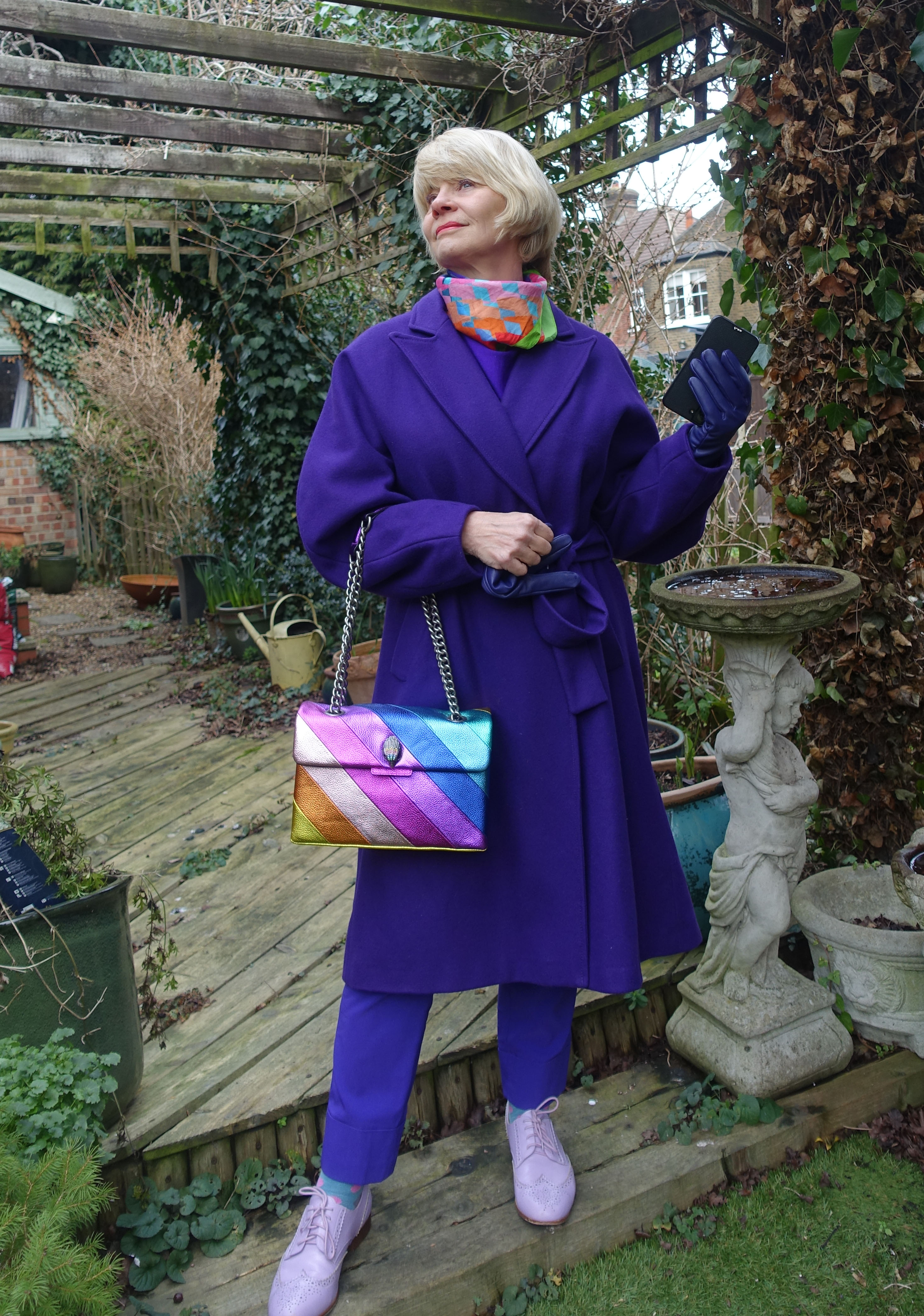 Desperately seeking fitted coats with belts in bright colours. Gail Hanlon in purple coat by Preen