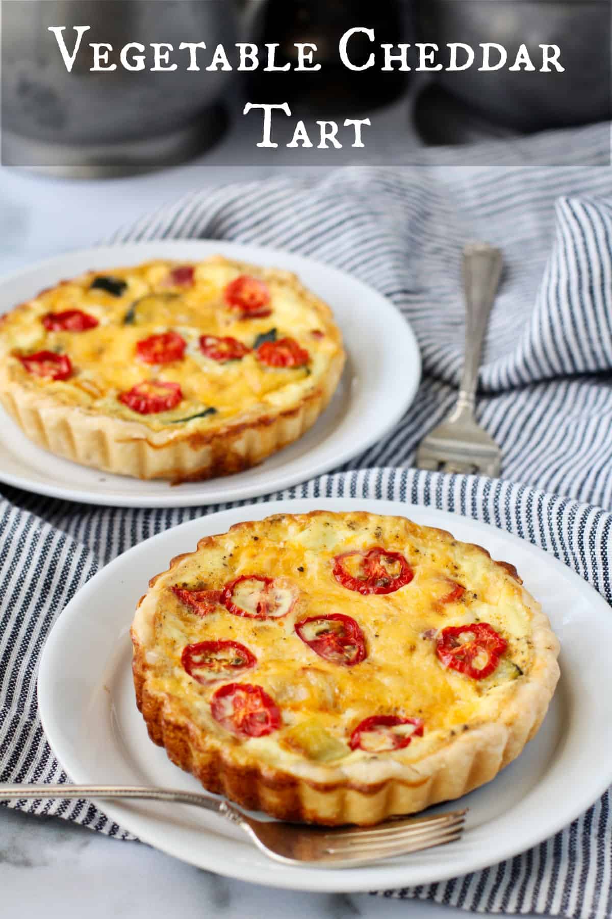Vegetable and Cheddar Tarts on two plates