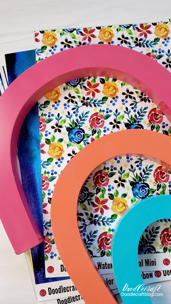 Step 2: Pattern Vinyl  After the rainbow pieces have dried completely, pick the pattern adhesive vinyl that matches your design theme the best.   I'm using mini flowers, rainbow wash and stripes.