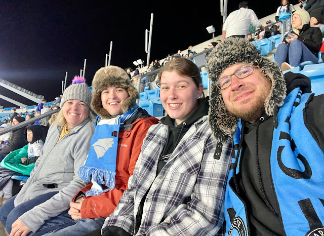 A selfie of the four of us From left to right: Me, Andy, Elizabeth, Dad. We are all bundled up in hats, gloves, and coats.