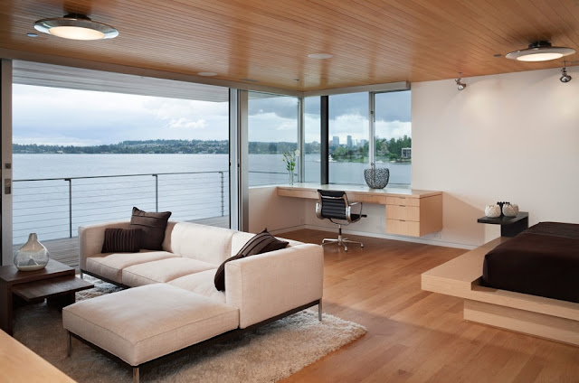 Picture of modern wooden bedroom with bed, sofa and working desk