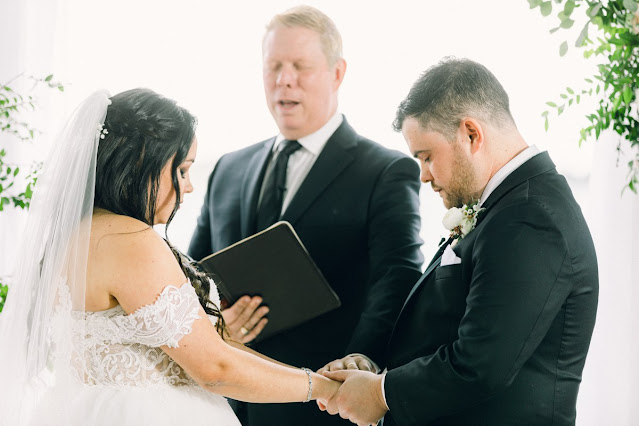 bride and groom praying during ceremony