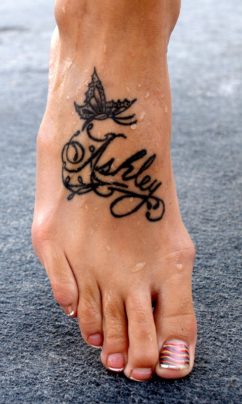 Word Lettering Name Tattoos Design on Foot name tattoo designs for men
