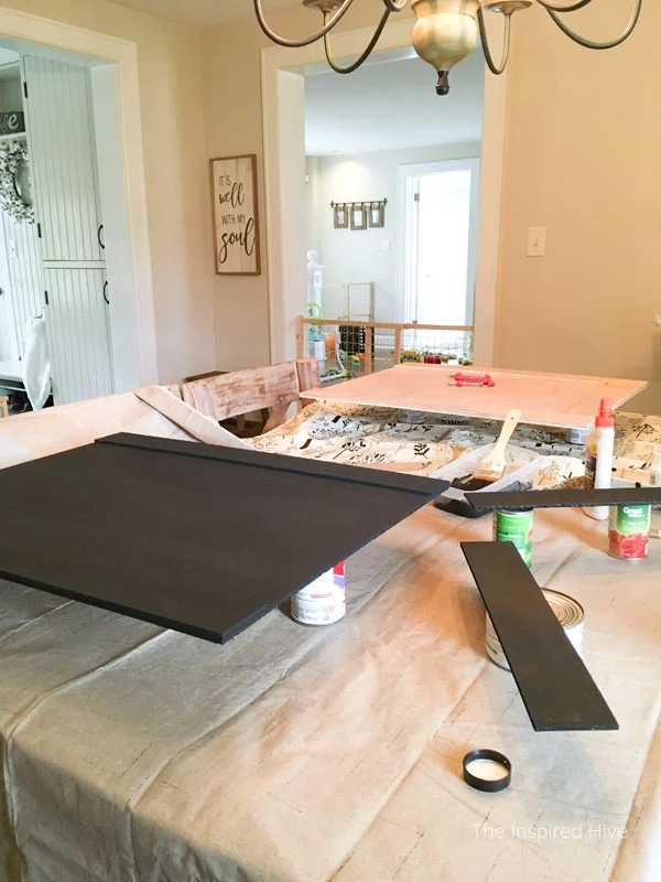 Dresser makeover. How I turned an old dresser into a modern farmhouse style entertainment center. This TV stand has weathered wood, black paint, and antique brass hardware.