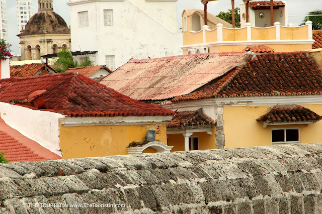 Red rooftops of Cartagena behind the thick city wall.