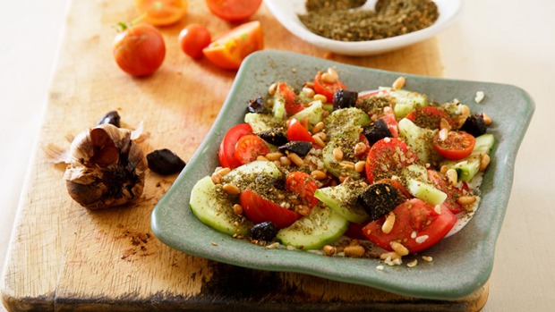 Tomatoes, pickled cucumber, za'atar and yoghurt tahini dressing