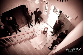 Megan walking down the stairs to Colin, her husband-to-be