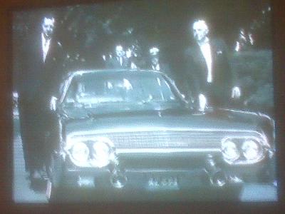 Agents on/ near rear of limo 1961