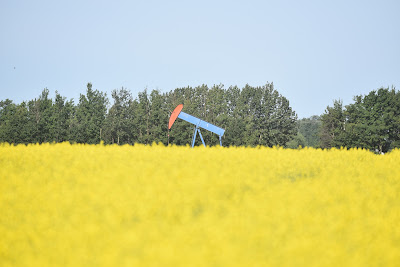 Oil rig Alberta beside Great Trail.