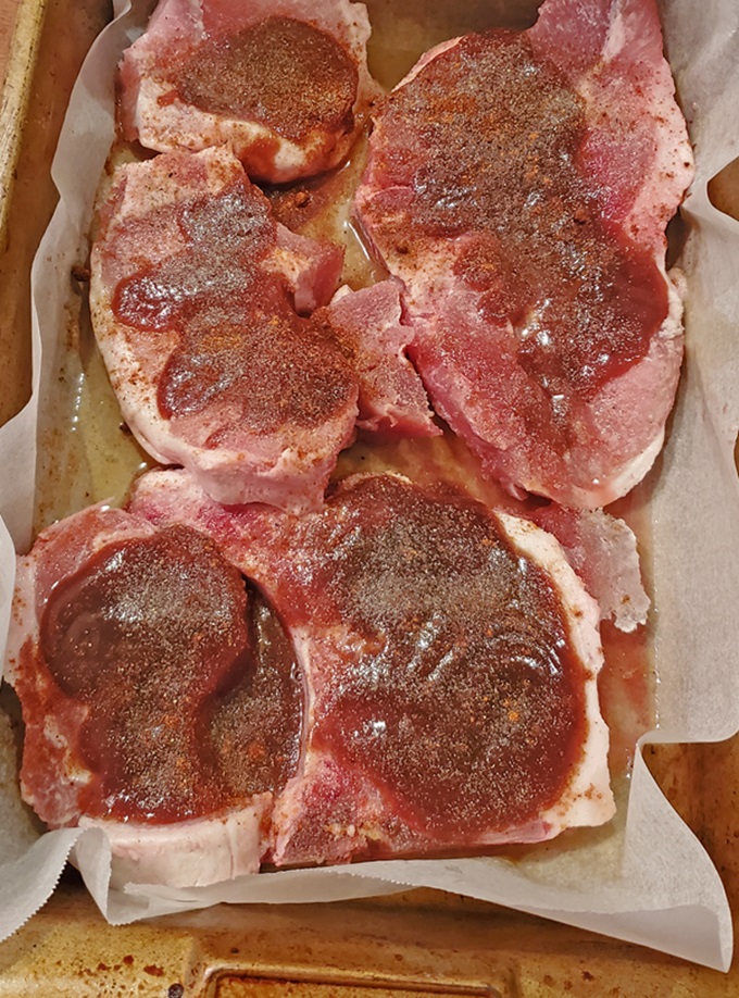 bbq homemade sauce on pork chops baked