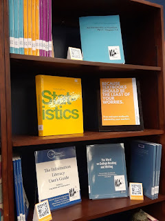 A book shelf containing OER textbooks