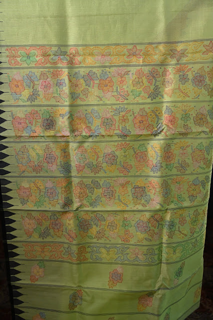 Lime green Rani phee silk jamdani saree with a temple border from Manipur.