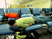 . Atlanta airport for 9 hours. We tried to sleep away the time, . (trying to catch some zzzz at the atlanta airport)