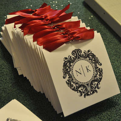The wedding program shown is a Christina layout on white linen cardstock 