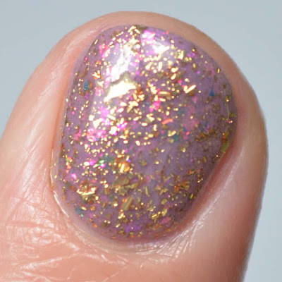 gold flakie nail polish close up swatch