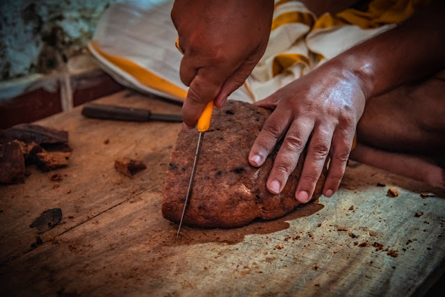 Cutting Poda Pitha for Lord Jagannath during Bahuda Jatra