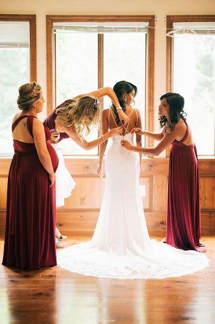 Niagara Wedding Planner - A Divine Affair - Meaghan and Scott - Photo by Marco Roxas Photography. Wedding ceremony and reception at Chateau des Charmes Winery in Niagara on the Lake. Navy Blue and Burgundy colours with Gold accents in the wedding attire and decor. Sweets table on wine barrels by Sweet Bash Co.