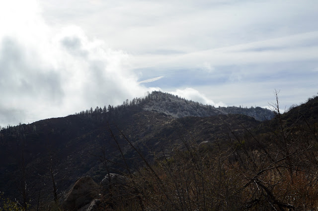 snow or ice visible in a break in the cloud