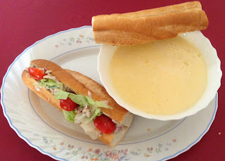 Baguette sandwich with a bawl of soup