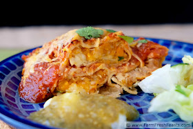 Recipe for a vegetarian enchilada casserole of corn tortillas stuffed with spicy sweet potatoes and onion