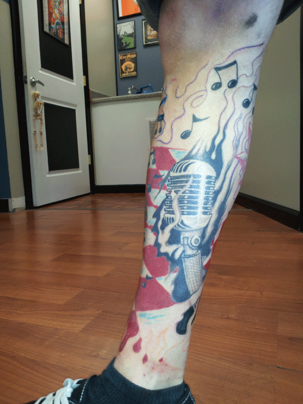 Added a lot more to Nick's lower leg tattoo The t Rock and Roll theme is 