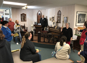 The SEJ group learning about Bishop Moore, his wax figure, and some of the history at Epworth by the Sea.