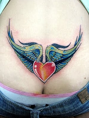 tattoos of wings for men. lower ack tattoo whit wings
