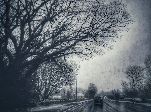 on the road, snowing