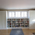 Living room built-in bookshelves and closets using BESTA shelves and PAX wardrobes